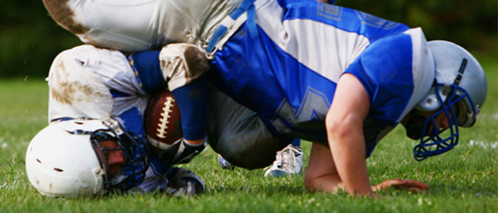 football players falling