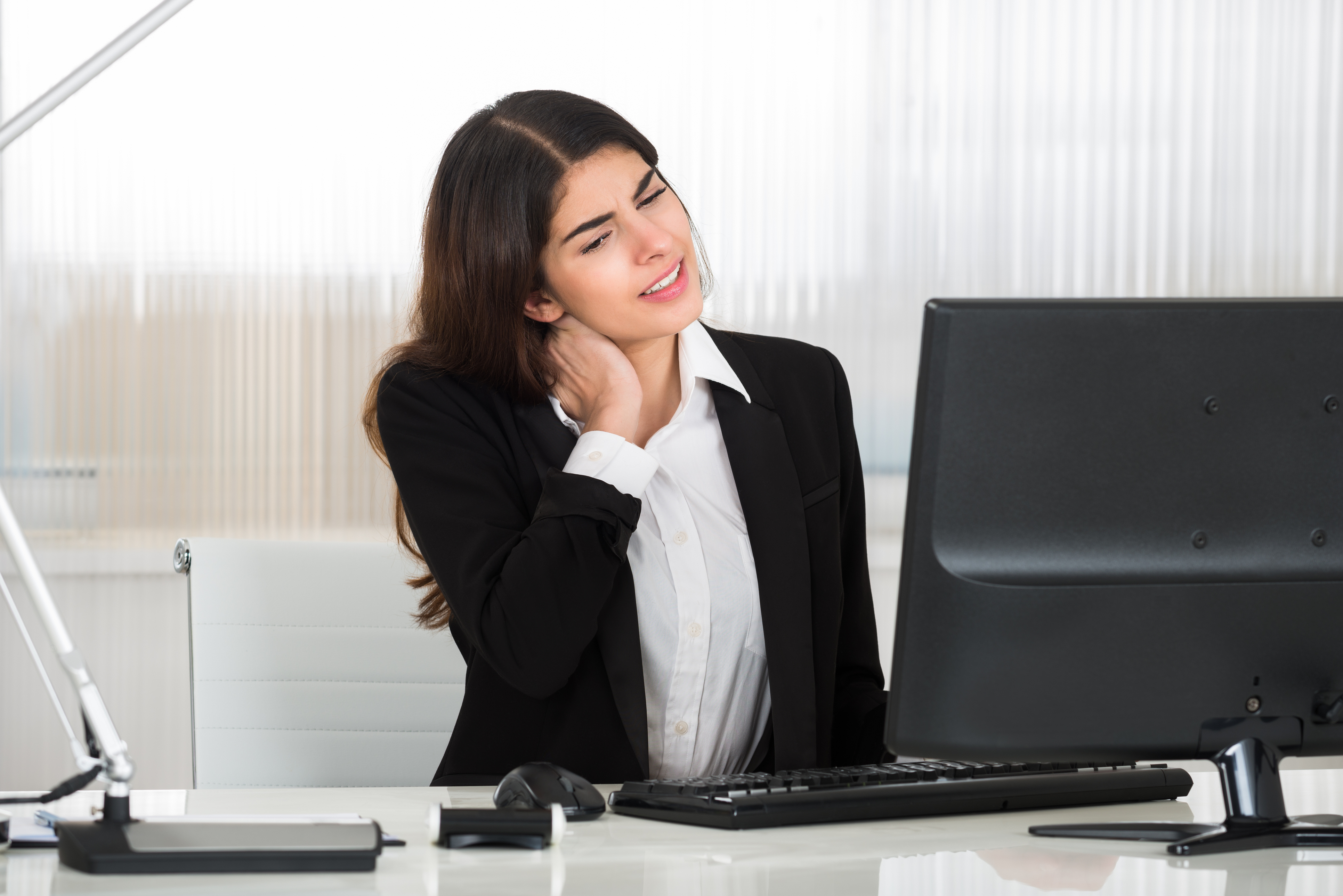 Woman with neck pain from computer posture